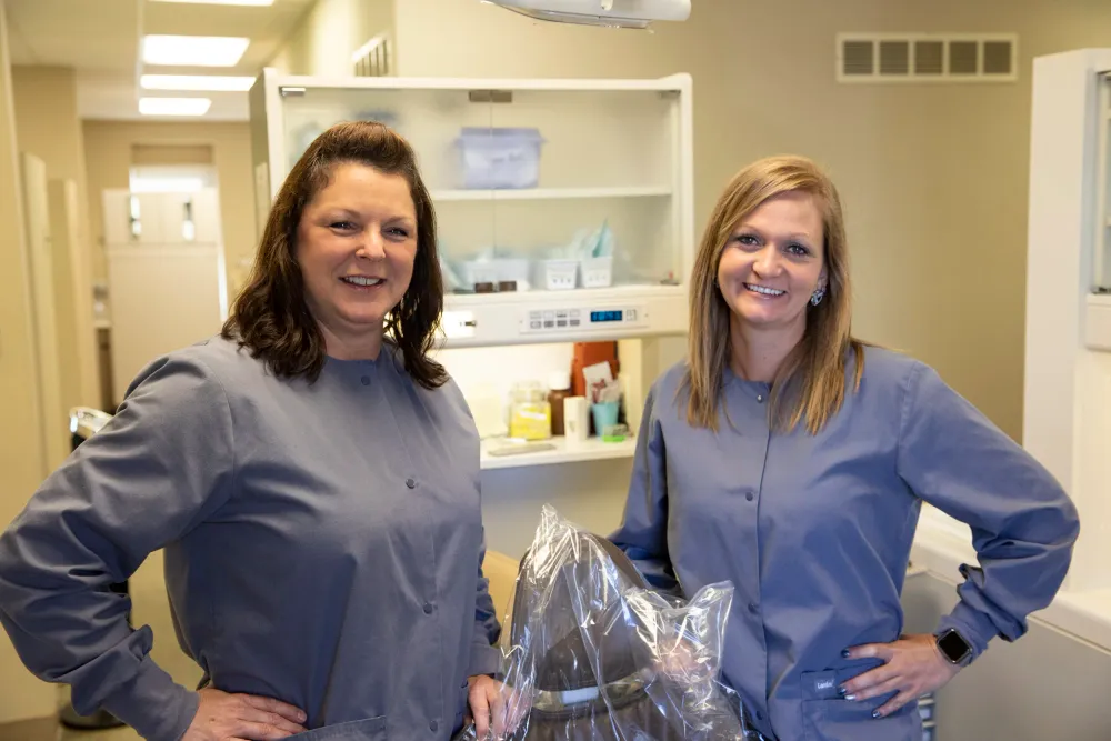 Two Cornerstone providers in scrubs in a bright operatory.